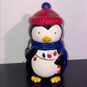 Festive penguin cookie jar
